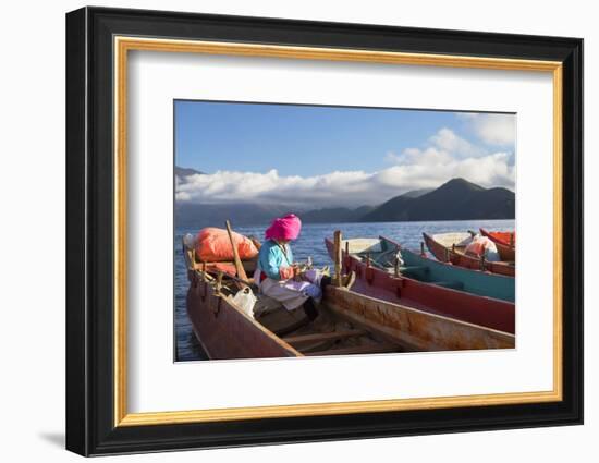 Mosu woman on boat, Luoshui, Lugu Lake, Yunnan, China, Asia-Ian Trower-Framed Photographic Print