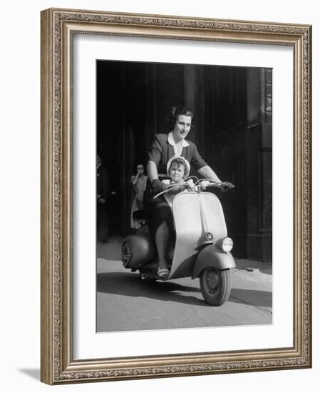 Mother and Baby Riding a Vespa Scooter-Dmitri Kessel-Framed Photographic Print