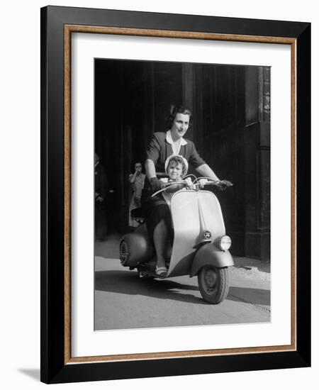 Mother and Baby Riding a Vespa Scooter-Dmitri Kessel-Framed Photographic Print