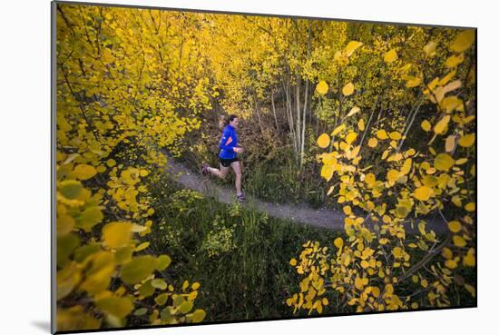 Mother And Daughter Trail Running In The Fall In Colorado-Liam Doran-Mounted Photographic Print