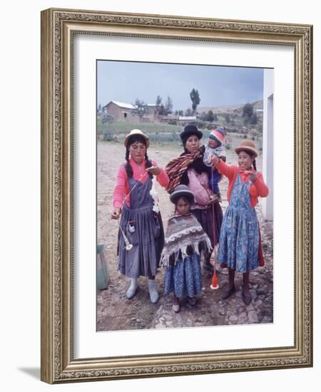 Mother and Four Children Wearing Derby Hats, Playing with Ball of Yarn, Andean Highlands of Bolivia-Bill Ray-Framed Photographic Print