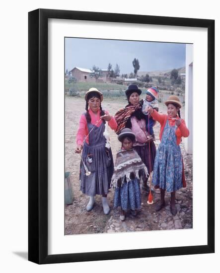 Mother and Four Children Wearing Derby Hats, Playing with Ball of Yarn, Andean Highlands of Bolivia-Bill Ray-Framed Photographic Print