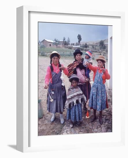 Mother and Four Children Wearing Derby Hats, Playing with Ball of Yarn, Andean Highlands of Bolivia-Bill Ray-Framed Photographic Print