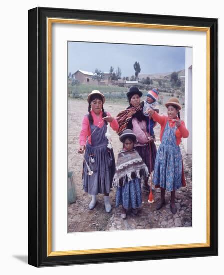 Mother and Four Children Wearing Derby Hats, Playing with Ball of Yarn, Andean Highlands of Bolivia-Bill Ray-Framed Photographic Print