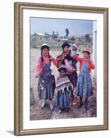 Mother and Four Children Wearing Derby Hats, Playing with Ball of Yarn, Andean Highlands of Bolivia-Bill Ray-Framed Photographic Print