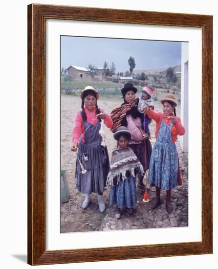 Mother and Four Children Wearing Derby Hats, Playing with Ball of Yarn, Andean Highlands of Bolivia-Bill Ray-Framed Photographic Print