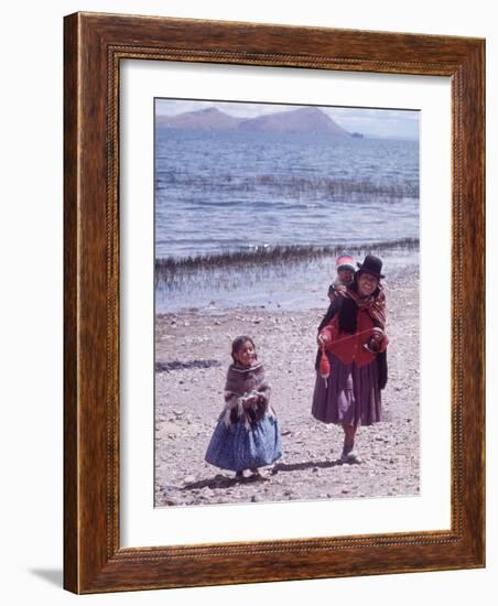 Mother and Two Children Holding Ball of Yarn, Andean Highlands of Bolivia-Bill Ray-Framed Photographic Print