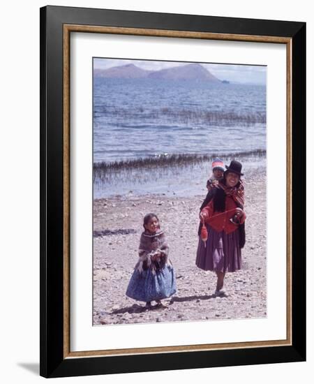 Mother and Two Children Holding Ball of Yarn, Andean Highlands of Bolivia-Bill Ray-Framed Photographic Print