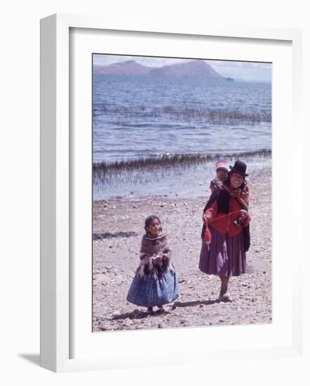 Mother and Two Children Holding Ball of Yarn, Andean Highlands of Bolivia-Bill Ray-Framed Photographic Print