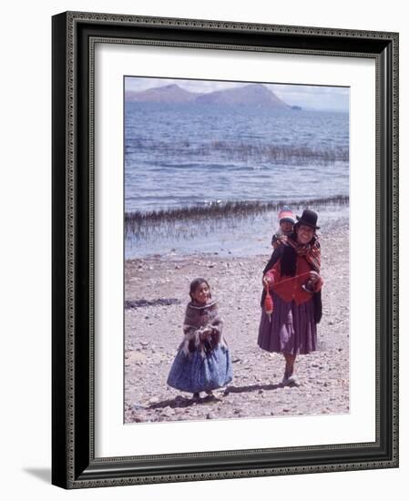 Mother and Two Children Holding Ball of Yarn, Andean Highlands of Bolivia-Bill Ray-Framed Photographic Print
