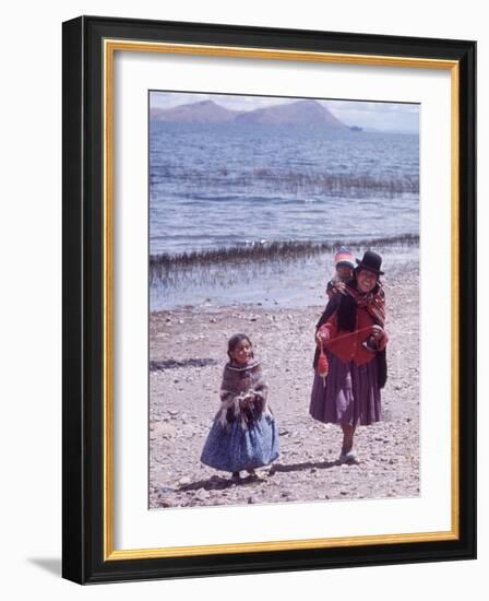 Mother and Two Children Holding Ball of Yarn, Andean Highlands of Bolivia-Bill Ray-Framed Photographic Print