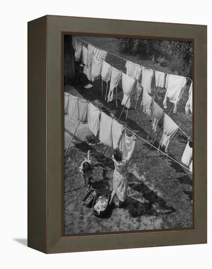 Mother Hanging Laundry Outdoors During Washday-Alfred Eisenstaedt-Framed Premier Image Canvas