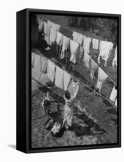 Mother Hanging Laundry Outdoors During Washday-Alfred Eisenstaedt-Framed Premier Image Canvas