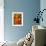 Mother Sews Her Son's Football Jersey As He Looks On-null-Framed Art Print displayed on a wall