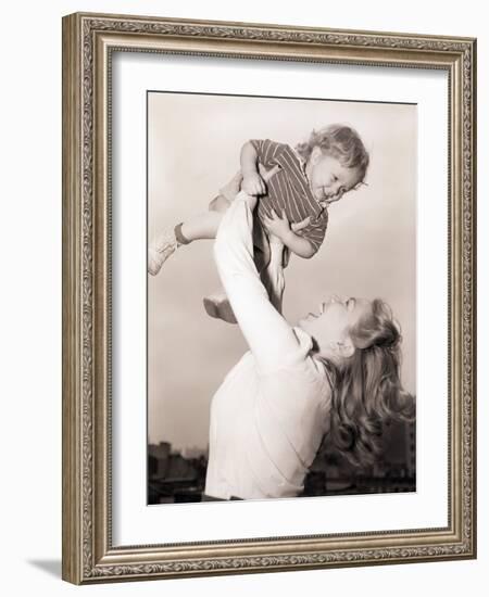 Mother Swinging Daughter up in the Air-Philip Gendreau-Framed Photographic Print