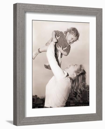 Mother Swinging Daughter up in the Air-Philip Gendreau-Framed Photographic Print