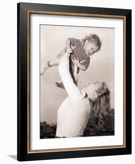 Mother Swinging Daughter up in the Air-Philip Gendreau-Framed Photographic Print