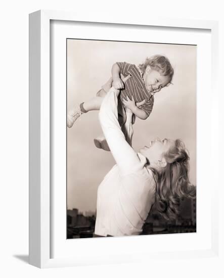 Mother Swinging Daughter up in the Air-Philip Gendreau-Framed Photographic Print