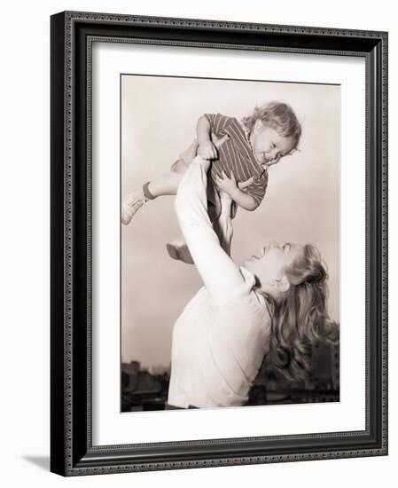 Mother Swinging Daughter up in the Air-Philip Gendreau-Framed Photographic Print