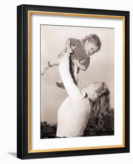 Mother Swinging Daughter up in the Air-Philip Gendreau-Framed Photographic Print