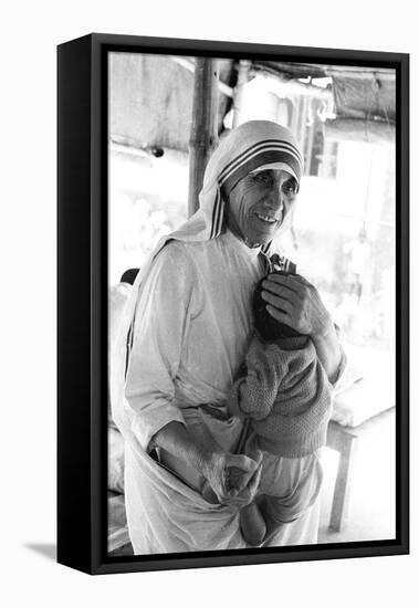 Mother Teresa with a Baby-null-Framed Premier Image Canvas