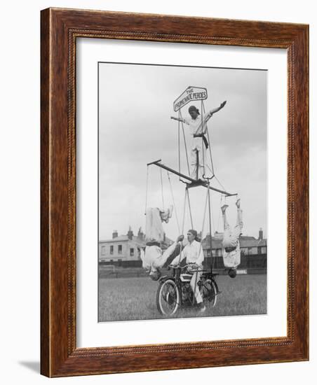 Motorcycle Acrobat Troupe Called "The Promenade Percies" Practise Their Act Involving Balance-null-Framed Photographic Print