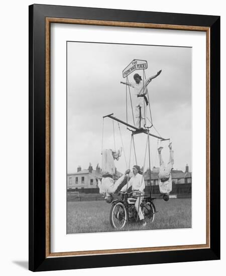 Motorcycle Acrobat Troupe Called "The Promenade Percies" Practise Their Act Involving Balance-null-Framed Photographic Print