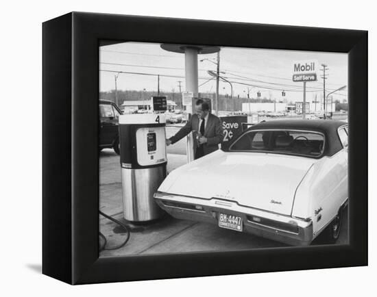 Motorist Filling Up His Own Car at a Self Service Gas Station-Ralph Morse-Framed Premier Image Canvas
