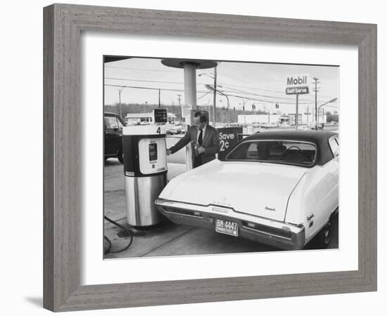 Motorist Filling Up His Own Car at a Self Service Gas Station-Ralph Morse-Framed Photographic Print