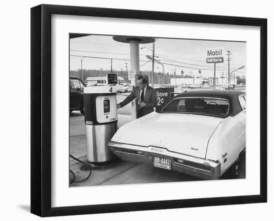 Motorist Filling Up His Own Car at a Self Service Gas Station-Ralph Morse-Framed Photographic Print