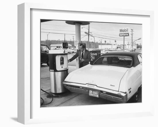 Motorist Filling Up His Own Car at a Self Service Gas Station-Ralph Morse-Framed Photographic Print