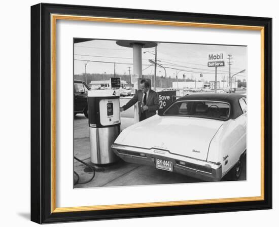 Motorist Filling Up His Own Car at a Self Service Gas Station-Ralph Morse-Framed Photographic Print