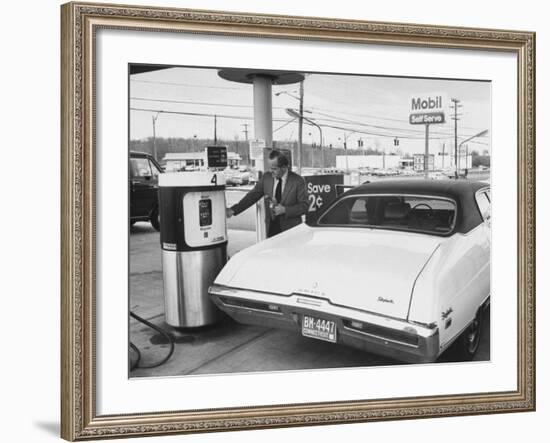 Motorist Filling Up His Own Car at a Self Service Gas Station-Ralph Morse-Framed Photographic Print