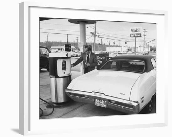 Motorist Filling Up His Own Car at a Self Service Gas Station-Ralph Morse-Framed Photographic Print