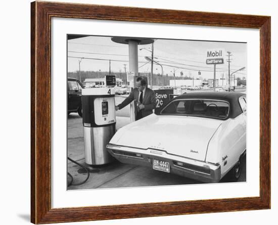 Motorist Filling Up His Own Car at a Self Service Gas Station-Ralph Morse-Framed Photographic Print