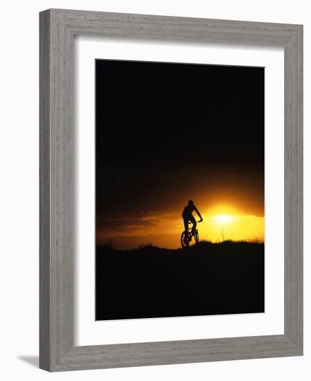 Mountain Biker Against Stormy Sunset, Fruita, Colorado, USA-Chuck Haney-Framed Photographic Print