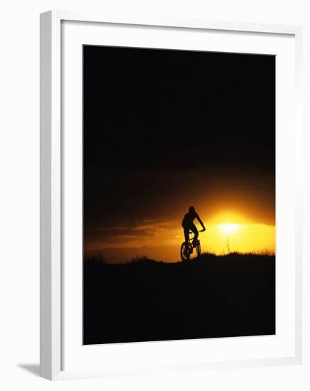 Mountain Biker Against Stormy Sunset, Fruita, Colorado, USA-Chuck Haney-Framed Photographic Print