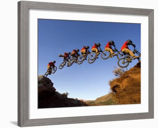 Mountain Biker Catches Air at Rampage Site near Virgin, Utah, USA-Chuck Haney-Framed Photographic Print