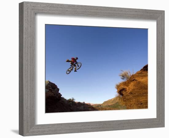 Mountain Biker Catches Air at Rampage Site near Virgin, Utah, USA-Chuck Haney-Framed Photographic Print