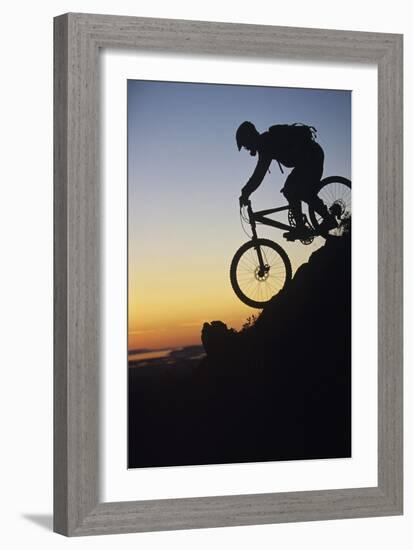 Mountain Biker Riding Down Slope-null-Framed Photo