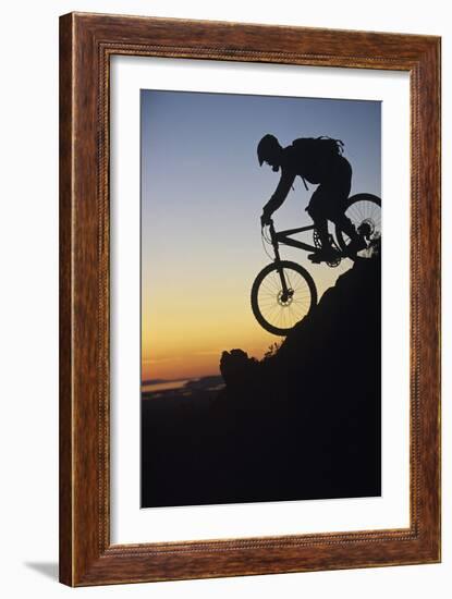 Mountain Biker Riding Down Slope-null-Framed Photo