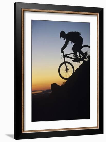 Mountain Biker Riding Down Slope-null-Framed Photo