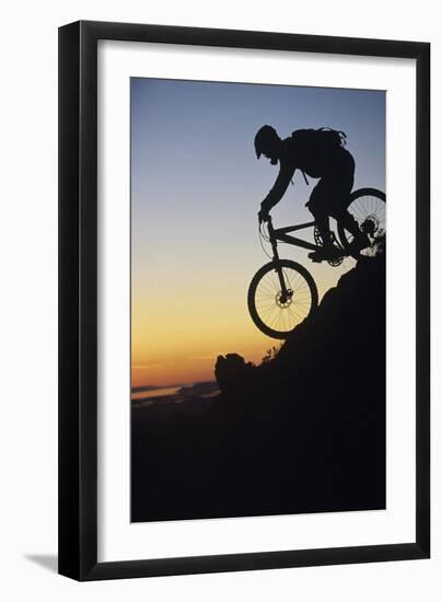 Mountain Biker Riding Down Slope-null-Framed Photo