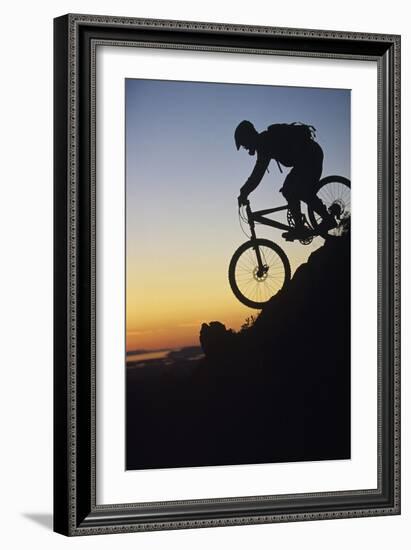 Mountain Biker Riding Down Slope-null-Framed Photo