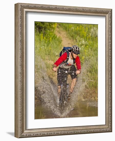 Mountain Biker Splashes Through Andrews Creek, Maah Daah Hey Trail in Medora, North Dakota, USA-Chuck Haney-Framed Photographic Print