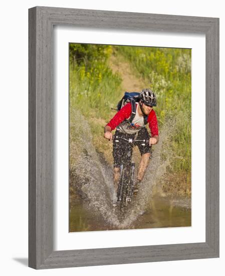 Mountain Biker Splashes Through Andrews Creek, Maah Daah Hey Trail in Medora, North Dakota, USA-Chuck Haney-Framed Photographic Print