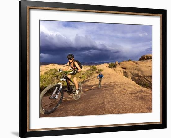 Mountain Bikers on the Slickrock Trail in Moab, Utah, Usa-Chuck Haney-Framed Photographic Print