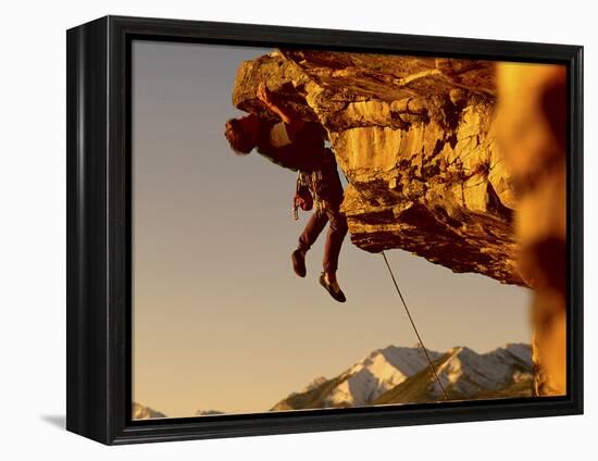 Mountain Climber Hanging from a Rock-null-Framed Premier Image Canvas