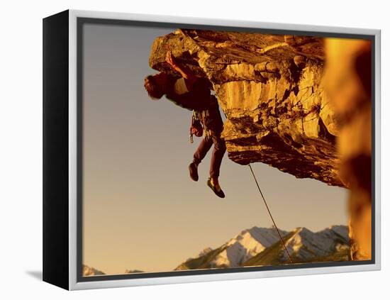 Mountain Climber Hanging from a Rock-null-Framed Premier Image Canvas