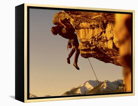 Mountain Climber Hanging from a Rock-null-Framed Premier Image Canvas